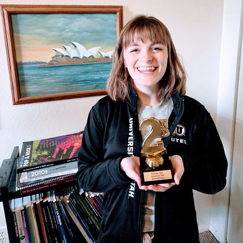 Sam S. holding her American Idol audition trophy.